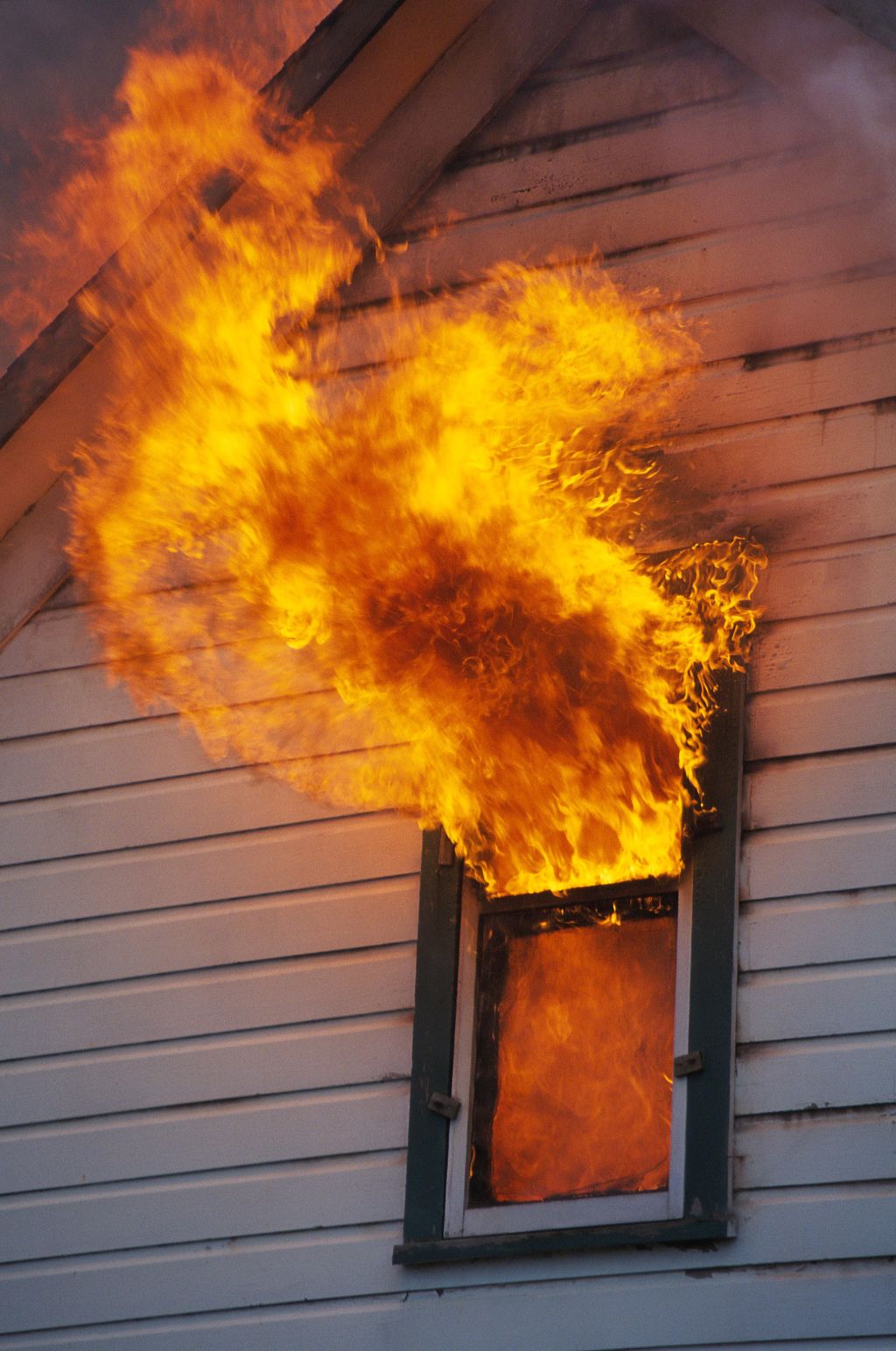 House burning, flames shooting through window