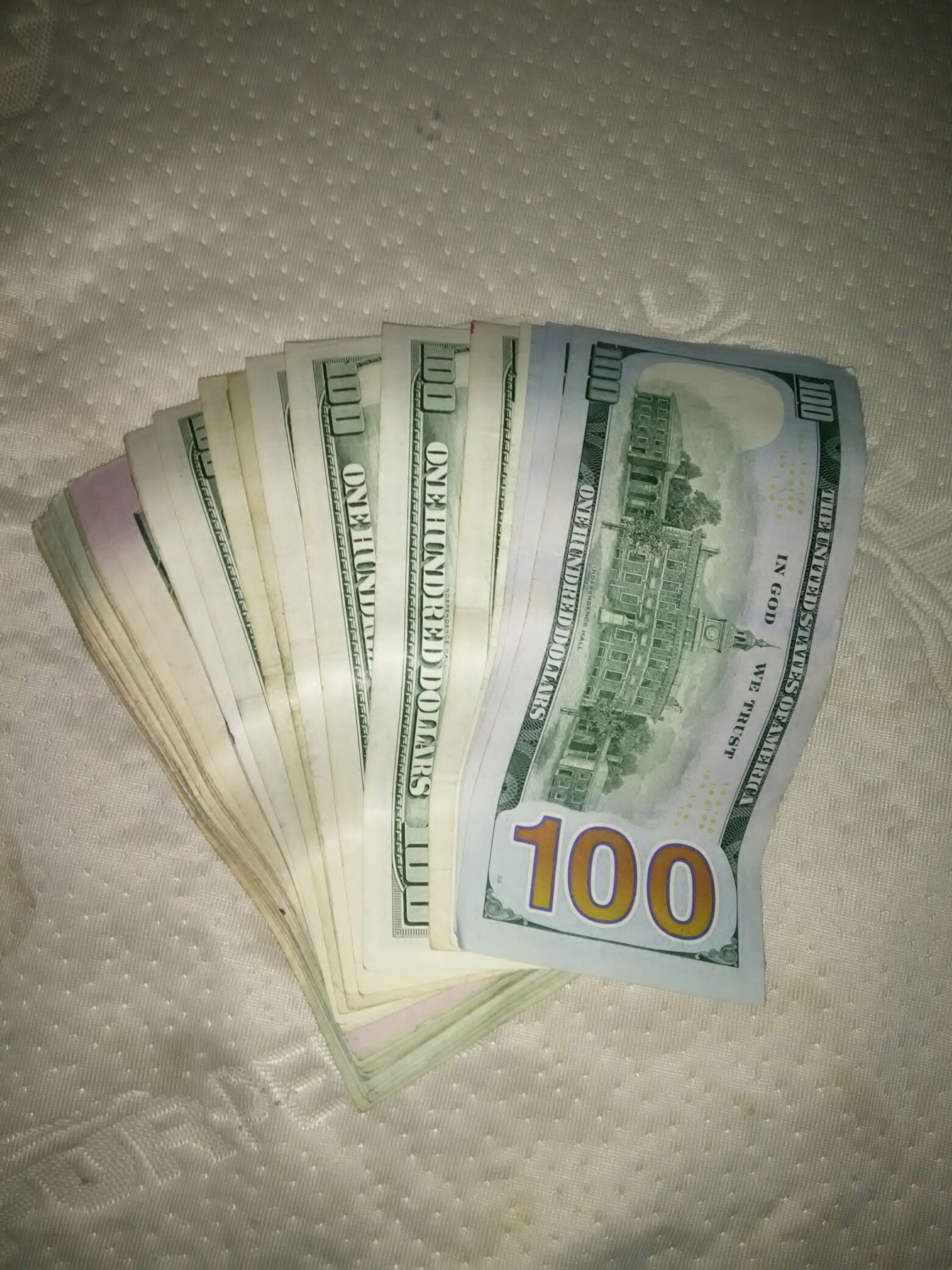 Close-Up Of Stack Of One Hundred Dollars