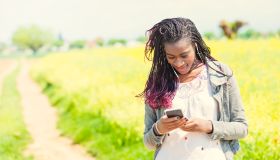 Young African woman checking for messages