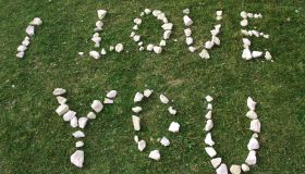 High Angle View Of I Love You Text Made From White Stones On Field