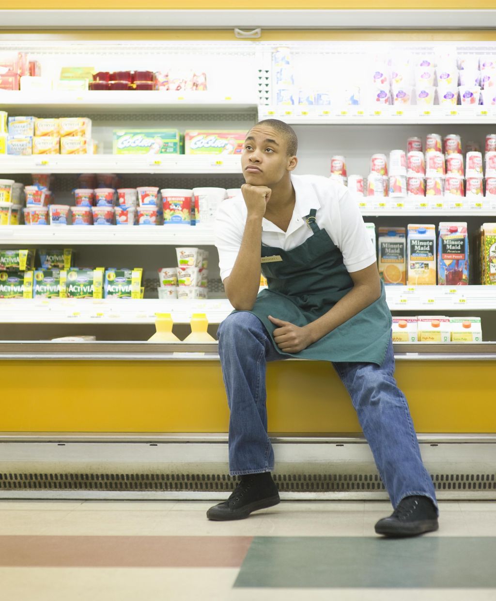 Teenage supermarket employee