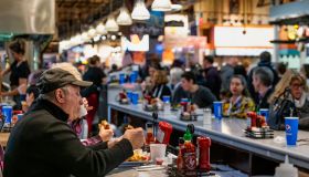 Diners eating lunch at the Reading Terminal Market in...