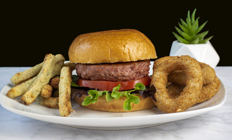 plant based burger with veggie fries and veggie onion rings