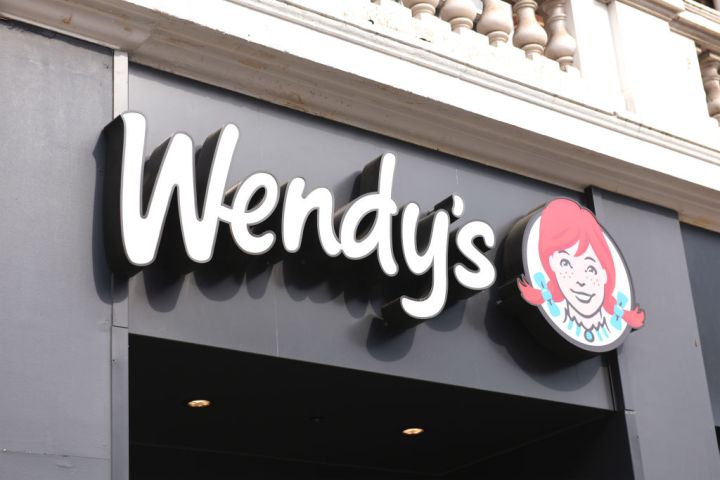 Wendy's store sign on building exterior, store frontage