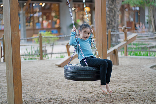 Little girl playing in the playground
