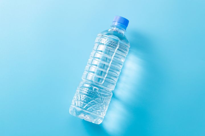 Bottled water on blue background.