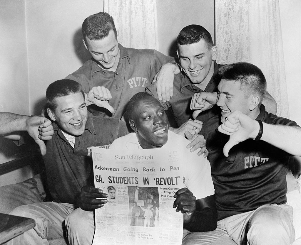 Bobby Grier Holding Newspaper on His Team's Protests