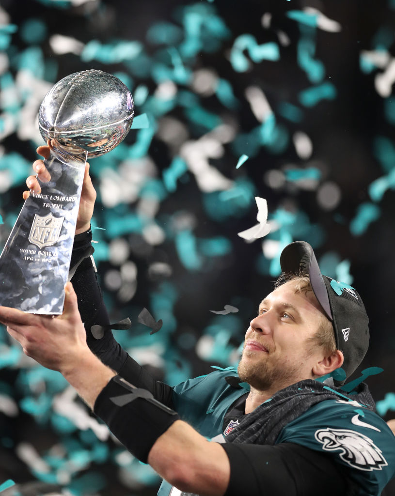 As confetti floated down at U.S. Bank Stadium, Philadelphia Eagles quarterback Nick Foles lifted up the Vince Lombardi trophy after leading his team to a 41-33 victory over the New England Patriots. After taking over as starter in December after Carson We