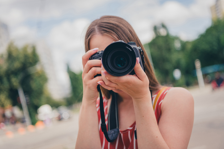 Photo of young girl wear trendy clothes photographing capturing taking pictures photos outdoors