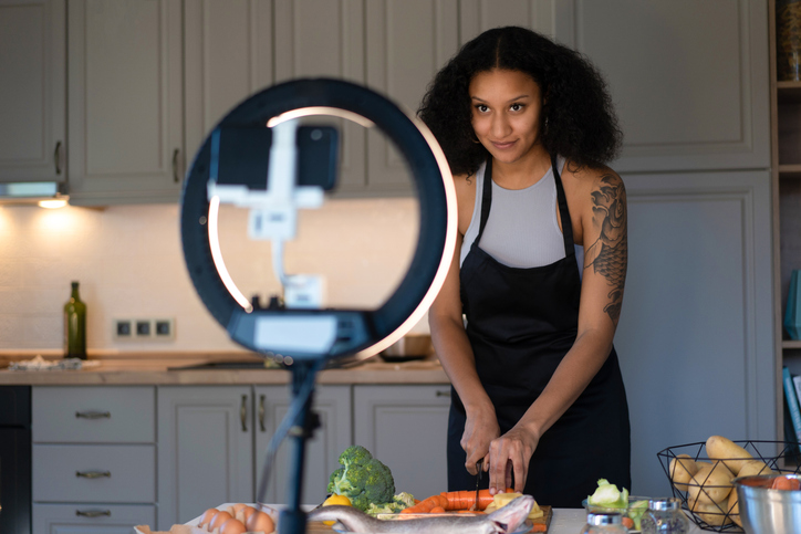 A vlogger demonstrating cooking instructions