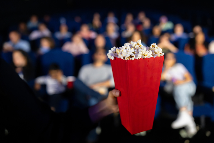 Woman at the cinema eating popcorn