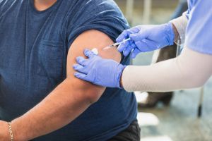 Healthcare Worker Administering Injection to Patient