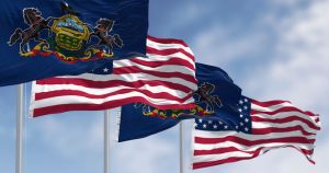 Pennsylvania state flags waving with the american flags
