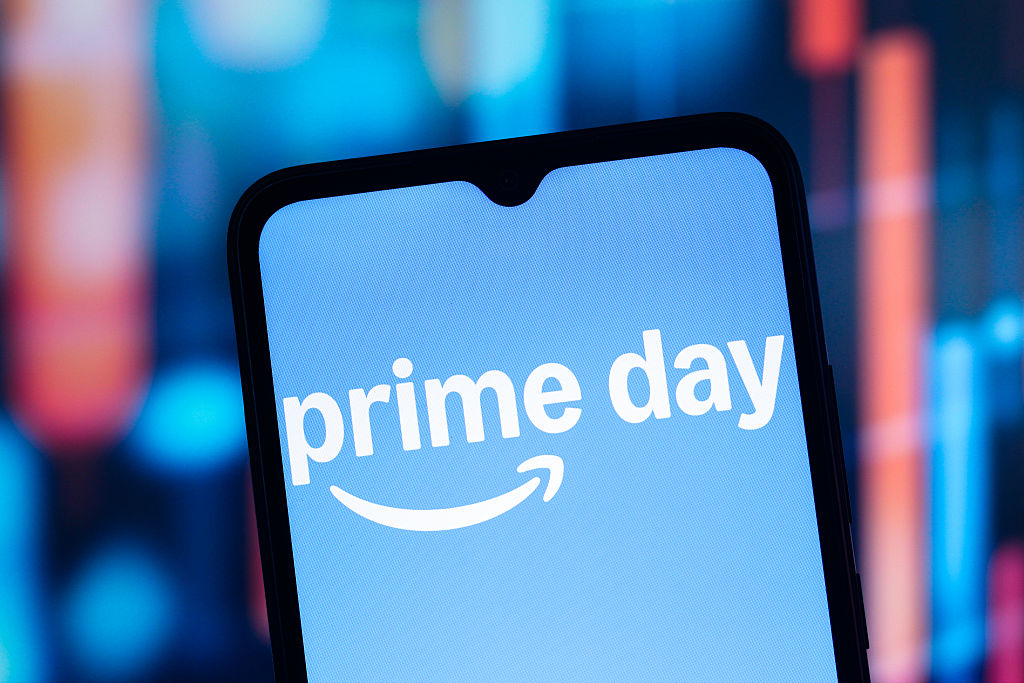 In this photo illustration, the Amazon Prime Day logo is...