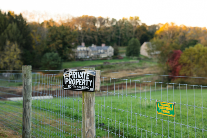 A "Private Property" sign at sunset time in the suburb of Philadelphia, Pennsylvania