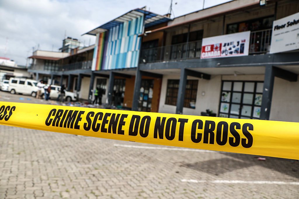 A yellow tape is seen cordoning off the scene following the...