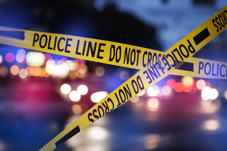 Police Line Do Not Cross Tape at Crime Scene at Night.