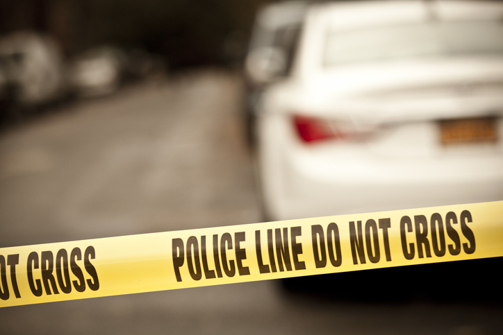 A scene of a crime taped with a do not cross line
