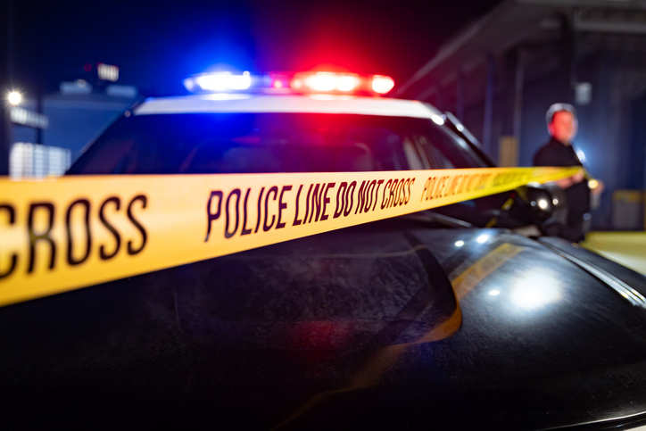 Flashing Lights, Hood of Cop Car, and Police Line Do Not Cross