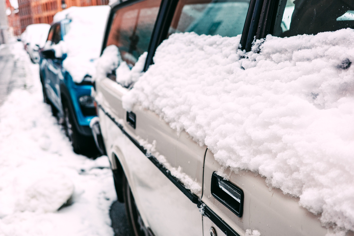 Snow Covered Parked Car During Winter Weather