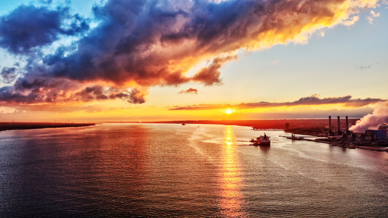 Aerial View of a Ship Headed into the Sunset on the Delaware River