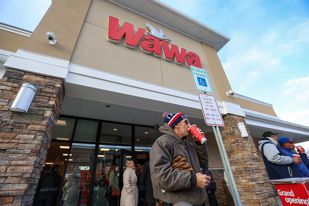 Rock Warnagiris of Hunlock Creek sips on a hot coffe outside Wawa during the grand opening of Wawa in Wilkes-Barre Township on Friday, December 6, 2024. (Photo by Jason Ardan/The Citizens' Voice via Getty Images)