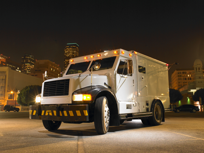 Armored car illuminated by artificial light