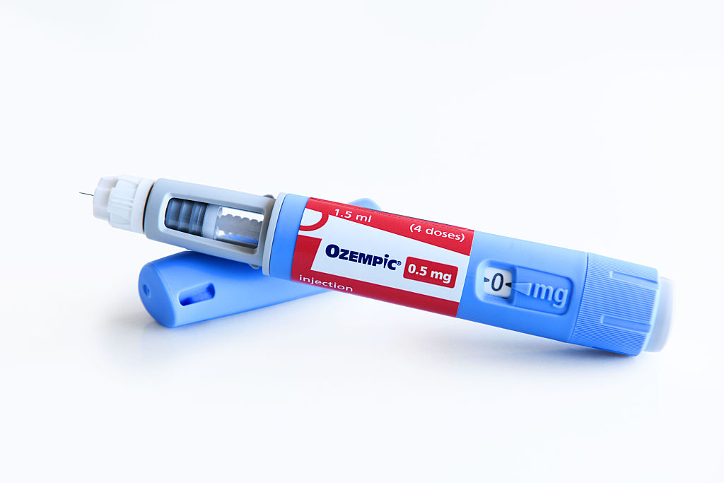 A photo illustration of Ozempic pen