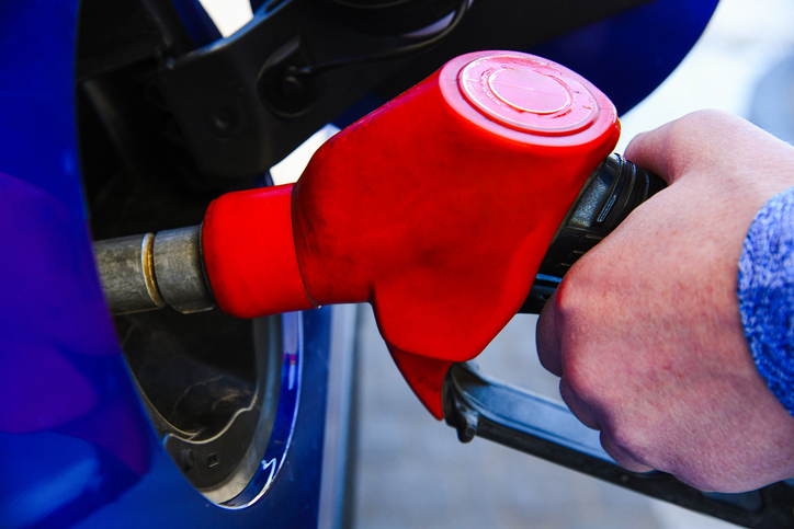 Refueling the car at a gas station fuel pump