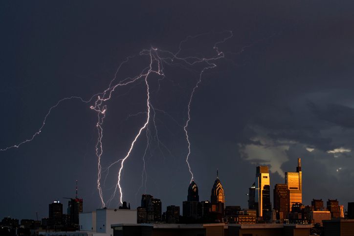 Giant lightning strike behind the Philly skyline catching the la