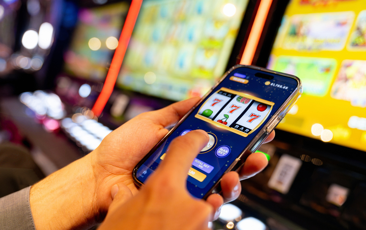Man playing a casino game using an app on a mobile phone