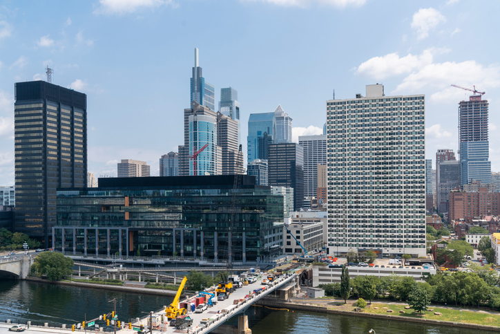 Aerial panoramic city view of Philadelphia financial downtown, Pennsylvania, USA. Chestnut Street Bridge and Market Bridge over Schuylkill River at summer day time. The economic and cultural center